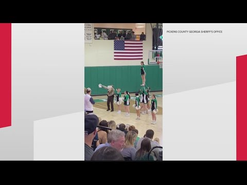 Pickens County school resource officer joins in on the fun during cheerleading event