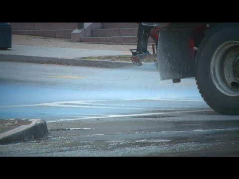 Why do road crews use blue salt to battle winter weather?