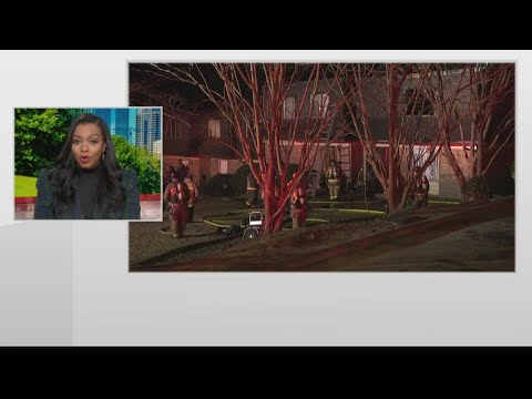 Woman saved after Atlanta home catches fire