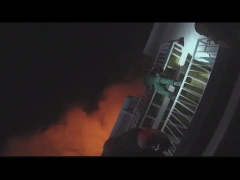 Florida sheriff's deputy rescues baby from burning home | Raw bodycam video