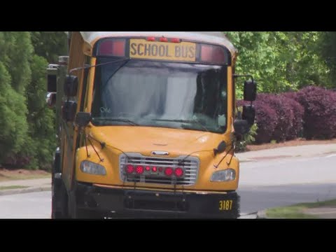 Gwinnett school bus shot up with multiple students on board, woman in custody, police say