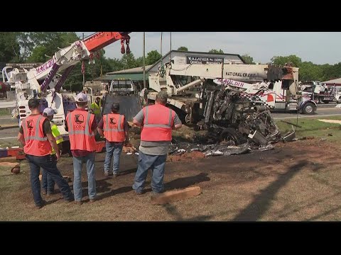4 hurt in crash involving crane truck in Cherokee County