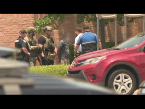 Disgruntled Home Goods employee with gun in custody after standoff