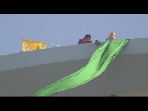 Protester scales building in DC after Supreme Court decision