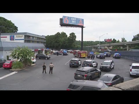 Marietta officer, man hurt in shooting in parking lot of Motel 6, police say