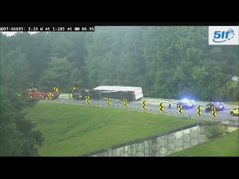 Overturned tractor trailer blocking ramp from I-285 SB to I-20