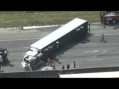 Overturned tractor-trailer shuts I-20 down in DeKalb County