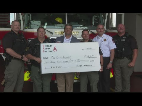 Reward check presented in arson case in Cobb County