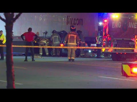 SUV crashes, is pinned under tractor-trailer in Atlanta