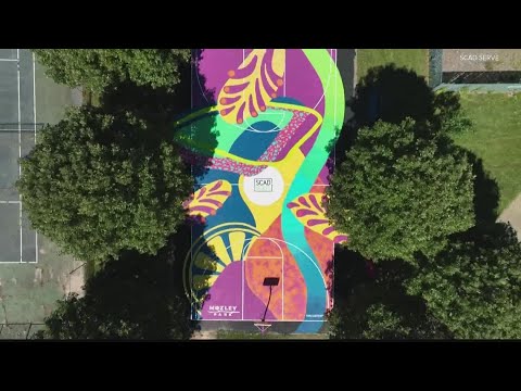 Former pro-basketball player turns courts into canvases