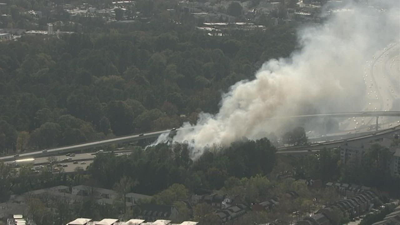 Chopper video: Firefighters fighting flames burning in woods near Buford Hwy, Buckhead apartment