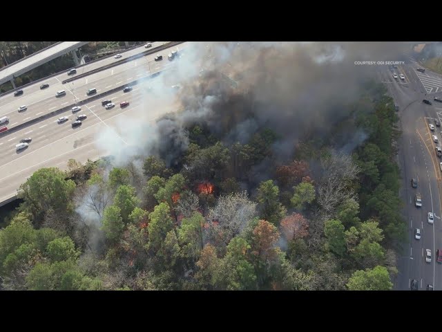 Drone: Flames, and smoke coming from homeless encampment behind Buckhead apartments