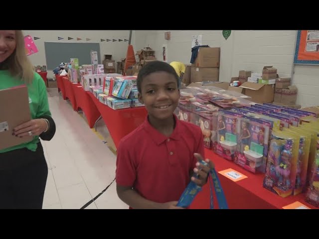 Students shop for family as reward for classroom excellence