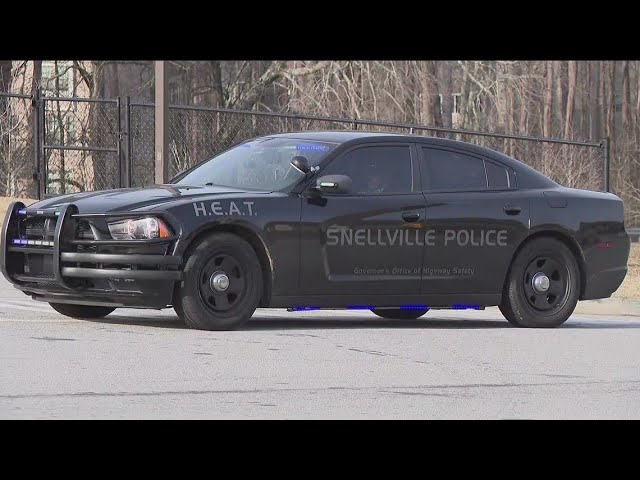 Man allegedly waving gun around shot by officer at Snellville gas station