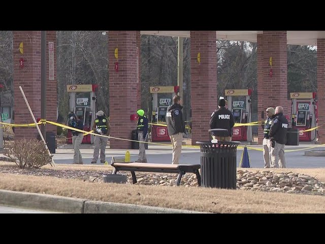 Man allegedly brandishing gun shot by officer at Snellville gas station