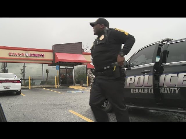 Man shot dead in Dunkin' Donuts parking lot after fight over gun